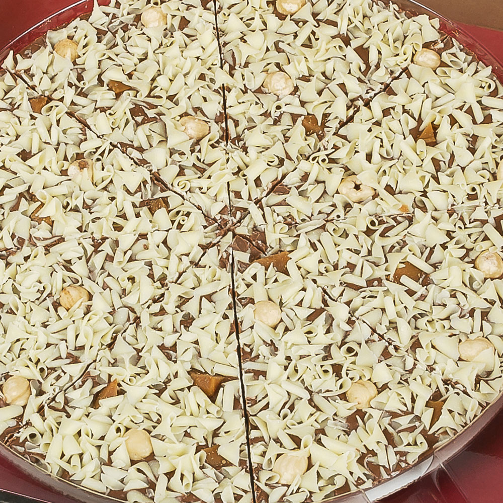 Creamy white chocolate curls and toffee pieces adorn our Gone Nuts Chocolate Pizza.